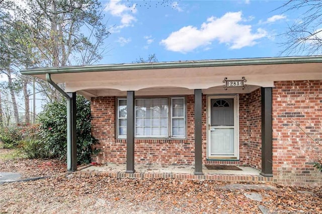property entrance with brick siding