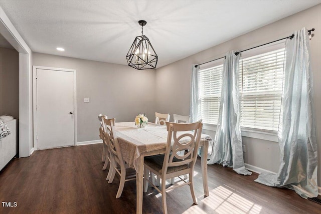 1803 Saint Paul Ave, Fayetteville, NC 28304 - dining space featuring a notable chandelier, wood finished floors, and baseboards