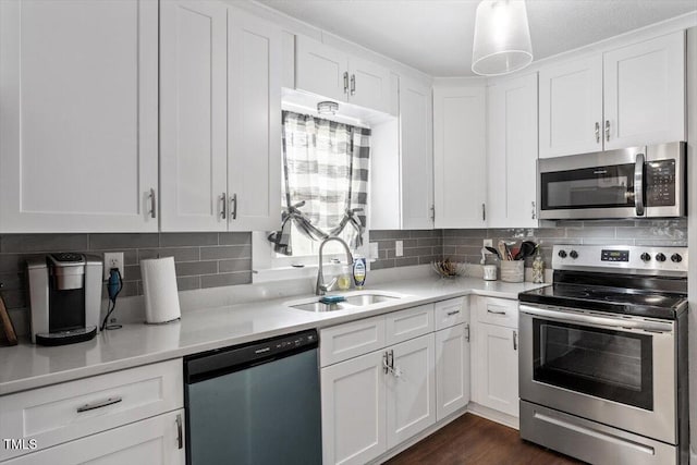 1803 Saint Paul Ave, Fayetteville, NC 28304 - kitchen with a sink, stainless steel appliances, white cabinetry, and light countertops
