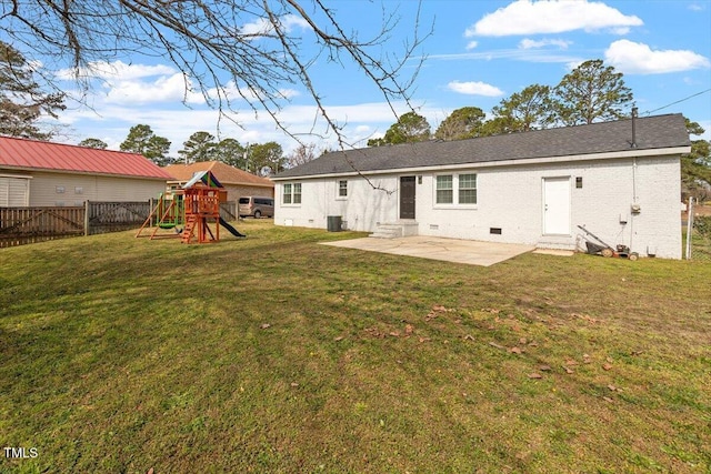1803 Saint Paul Ave, Fayetteville, NC 28304 - rear view of house featuring a playground, a yard, a patio area, and a fenced backyard