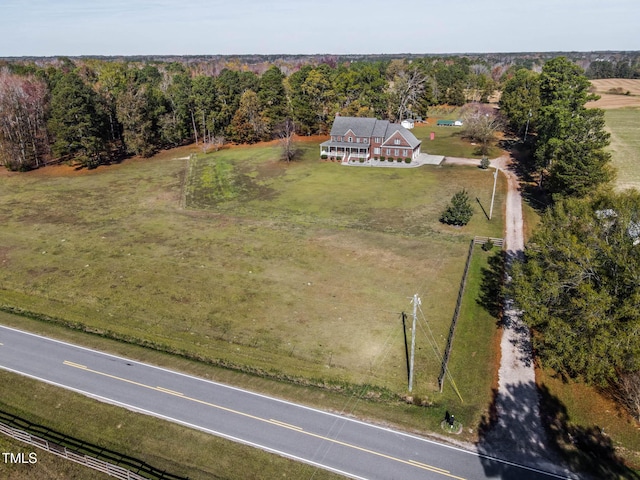 drone / aerial view with a rural view and a wooded view