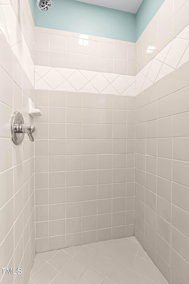 full bathroom with a tile shower