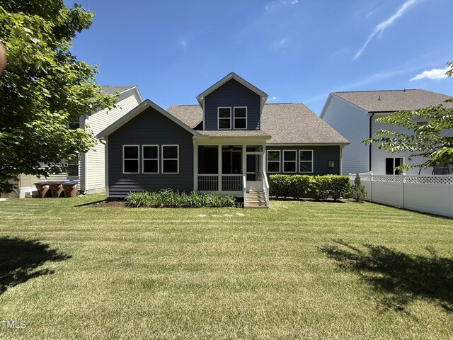 1564 Highpoint St, Wake Forest, NC 27587 - back of property featuring a sunroom and a shingled roof