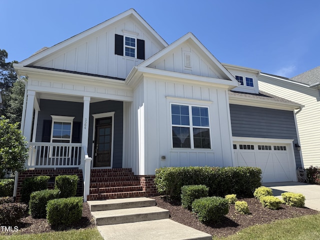 1564 Highpoint St, Wake Forest, NC 27587 - modern farmhouse featuring board and batten siding, a porch, driveway, a garage, and a shingled roof
