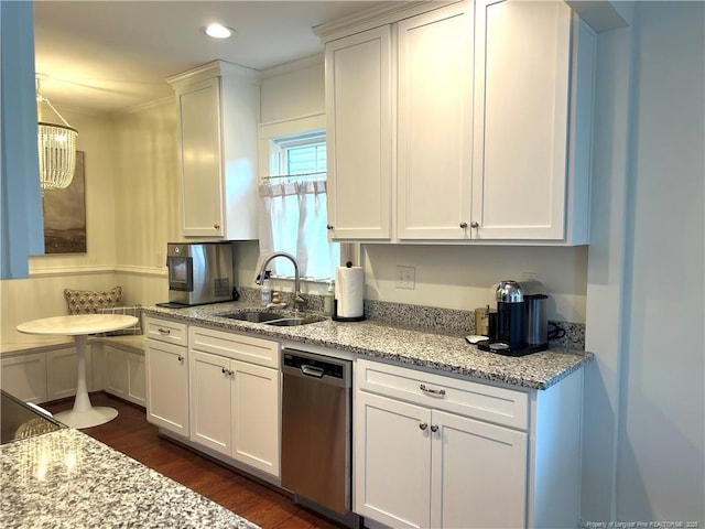 kitchen featuring stainless steel dishwasher, white cabinets, dark wood-style flooring, and a sink