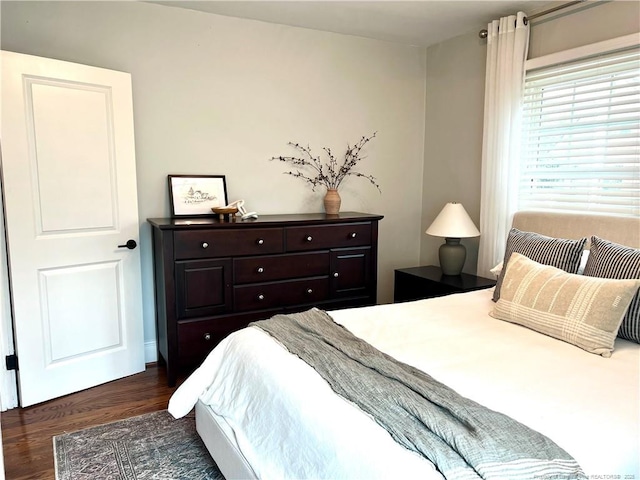 bedroom featuring dark wood-style floors