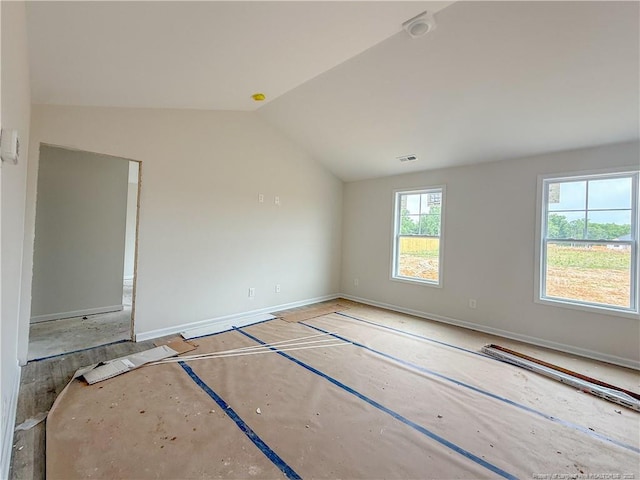 266 Guard Ln, Parkton, NC 28371 - spare room with vaulted ceiling and baseboards