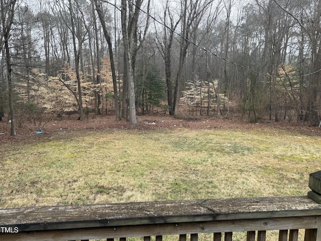 view of yard with a wooded view