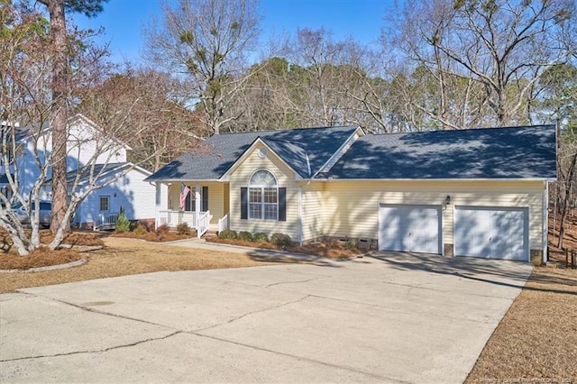 ranch-style home with a garage, covered porch, and concrete driveway