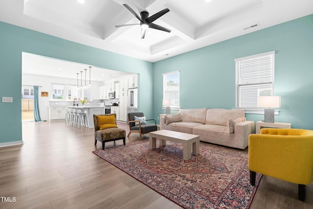74 Silver Moon Ln, Clayton, NC 27527 - living room with visible vents, beamed ceiling, wood finished floors, coffered ceiling, and a ceiling fan