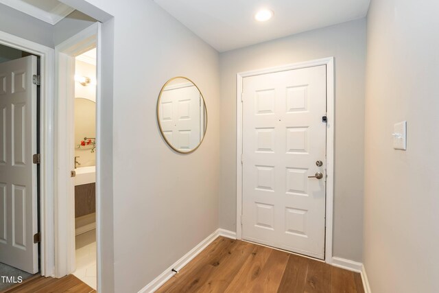 700 Bishops Park Dr Unit 205, Raleigh, NC 27605 - doorway to outside featuring wood finished floors, baseboards, and recessed lighting