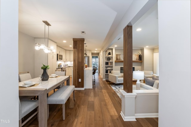 700 Bishops Park Dr Unit 205, Raleigh, NC 27605 - dining area featuring dark wood-style flooring, recessed lighting, and baseboards