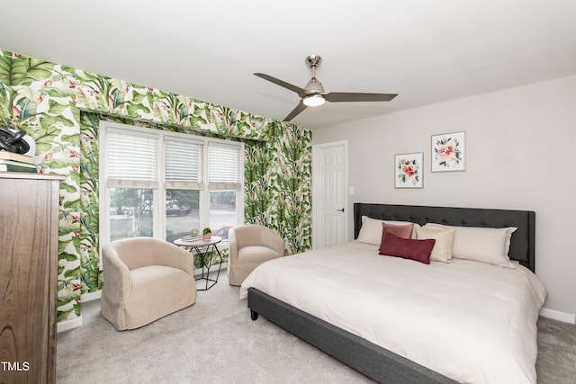 700 Bishops Park Dr Unit 205, Raleigh, NC 27605 - bedroom featuring carpet floors, baseboards, wallpapered walls, and a ceiling fan