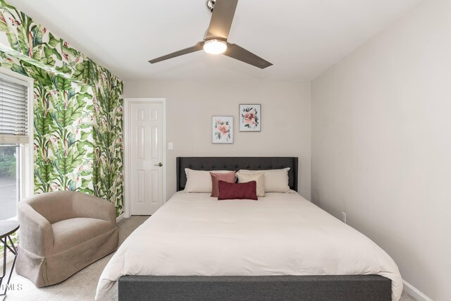 700 Bishops Park Dr Unit 205, Raleigh, NC 27605 - bedroom featuring wallpapered walls, carpet flooring, baseboards, and ceiling fan