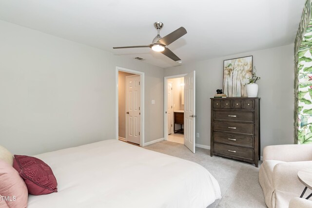 700 Bishops Park Dr Unit 205, Raleigh, NC 27605 - bedroom with light colored carpet, a ceiling fan, and baseboards