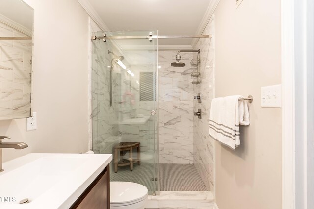700 Bishops Park Dr Unit 205, Raleigh, NC 27605 - bathroom featuring toilet, ornamental molding, vanity, and a marble finish shower