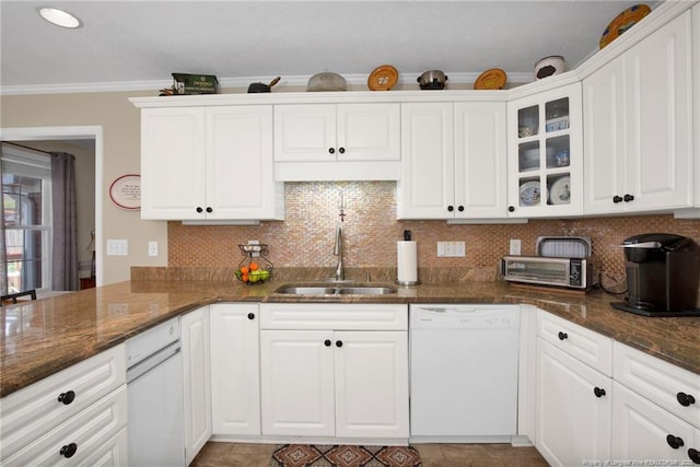 kitchen with tasteful backsplash, dishwasher, ornamental molding, white cabinetry, and a sink