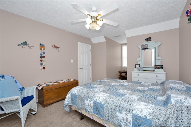 bedroom featuring light colored carpet, ceiling fan, and a textured ceiling