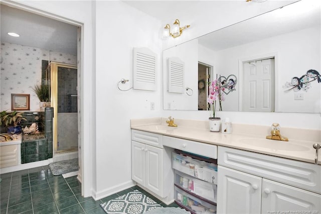 bathroom with a stall shower, a sink, wallpapered walls, double vanity, and tile patterned flooring