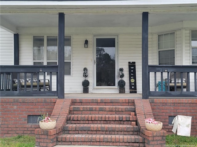 41 Lenor Dr, Lumberton, NC 28360 - view of exterior entry with brick siding and covered porch