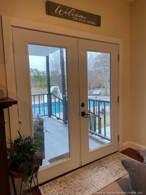 41 Lenor Dr, Lumberton, NC 28360 - doorway to outside featuring plenty of natural light, french doors, and baseboards