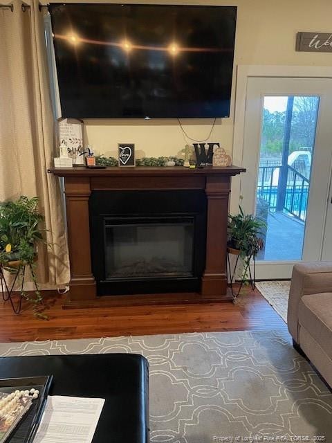 41 Lenor Dr, Lumberton, NC 28360 - room details with a glass covered fireplace and wood finished floors