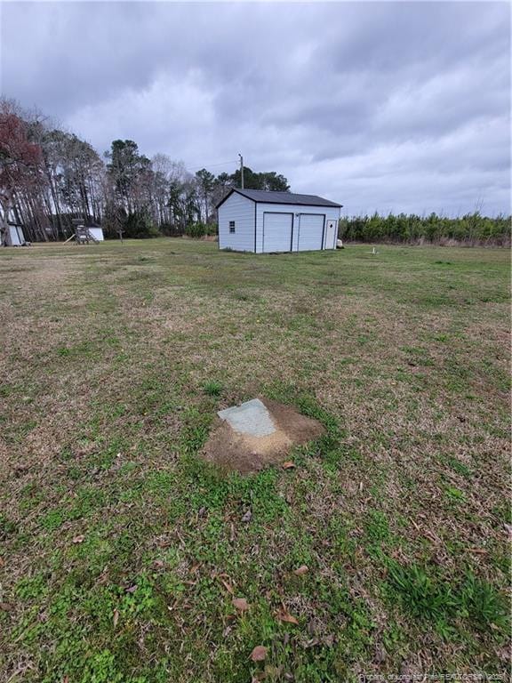 41 Lenor Dr, Lumberton, NC 28360 - view of yard with a detached garage and an outdoor structure
