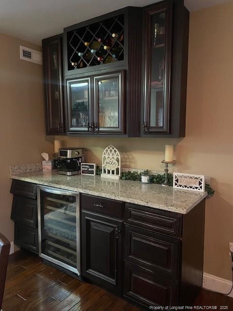 41 Lenor Dr, Lumberton, NC 28360 - bar featuring dark wood finished floors, wine cooler, visible vents, and baseboards