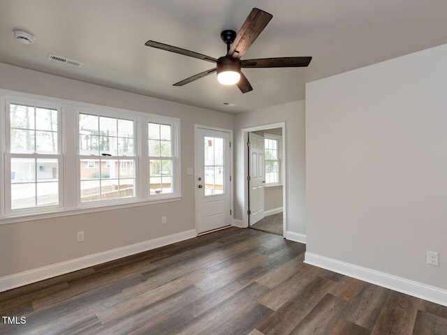 foyer with dark wood-style floors, baseboards, and a ceiling fan