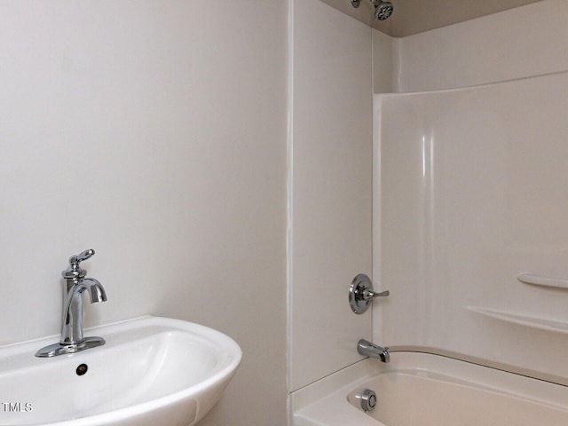 full bathroom featuring a sink and shower / washtub combination