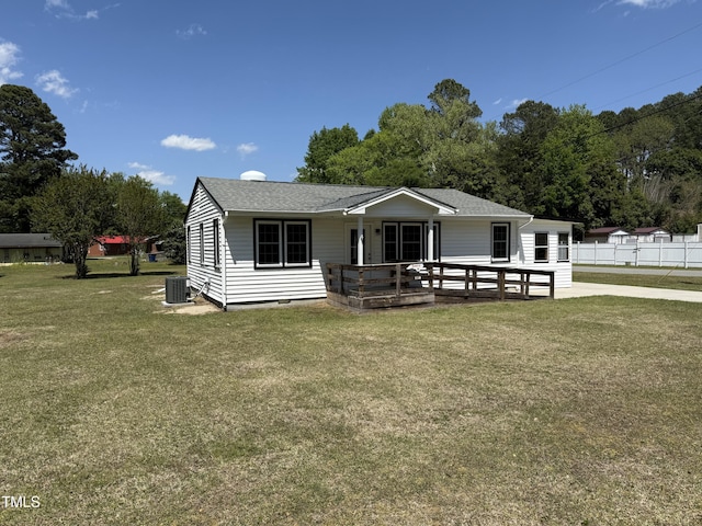 view of front of house featuring central AC unit and a shingled roof