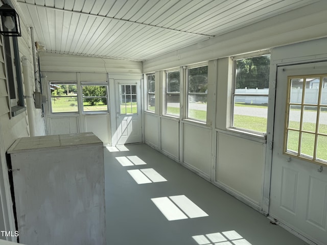 unfurnished sunroom with plenty of natural light
