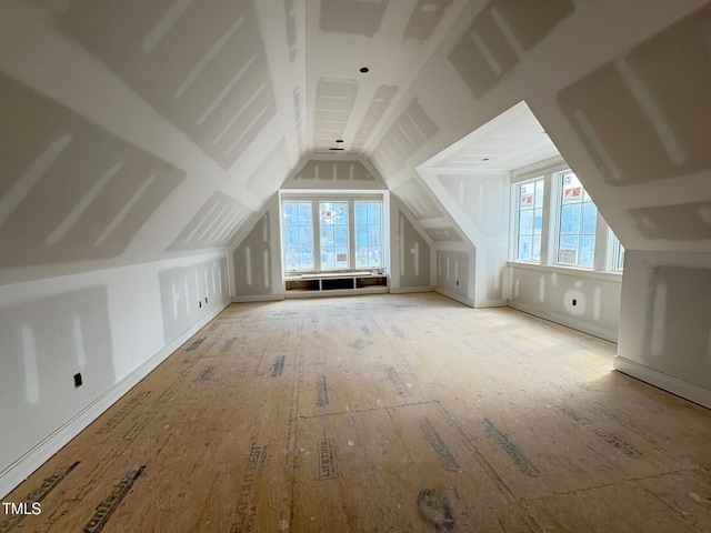 bonus room with vaulted ceiling and plenty of natural light