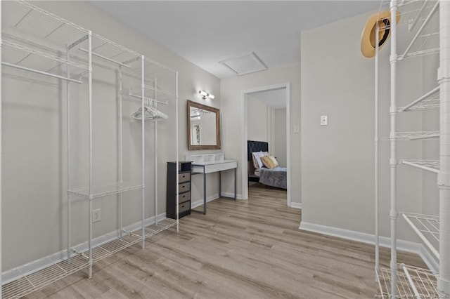 spacious closet with wood finished floors