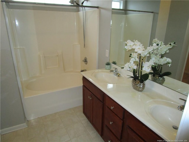 bathroom featuring tile patterned floors, shower / washtub combination, double vanity, and a sink