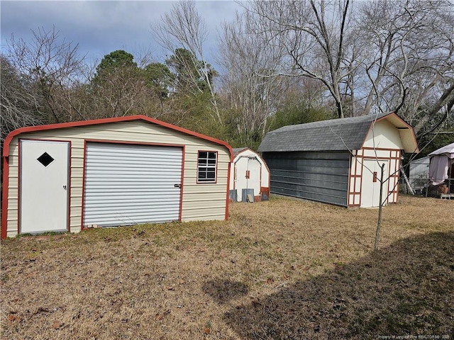 detached garage featuring a storage unit