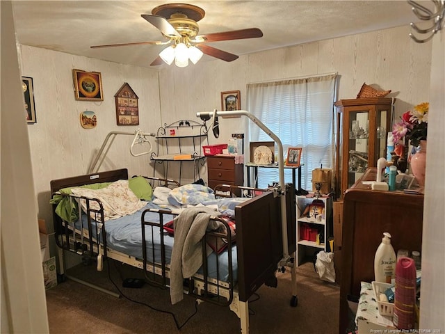 bedroom with a ceiling fan and carpet floors