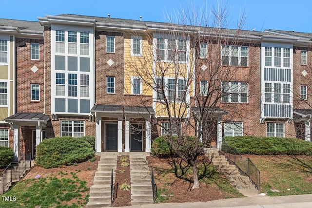 view of front of property featuring brick siding