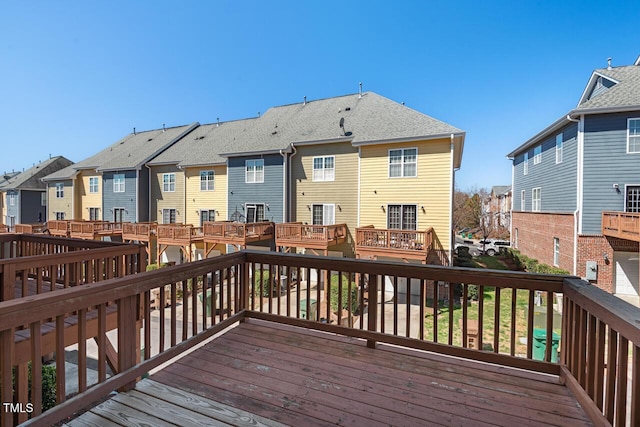 wooden deck featuring a residential view