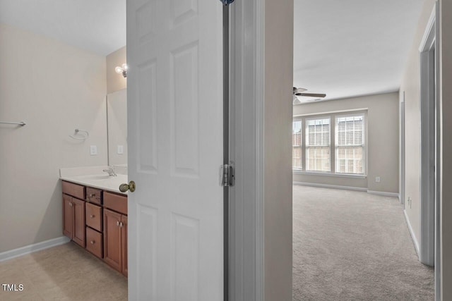 bathroom with baseboards and vanity