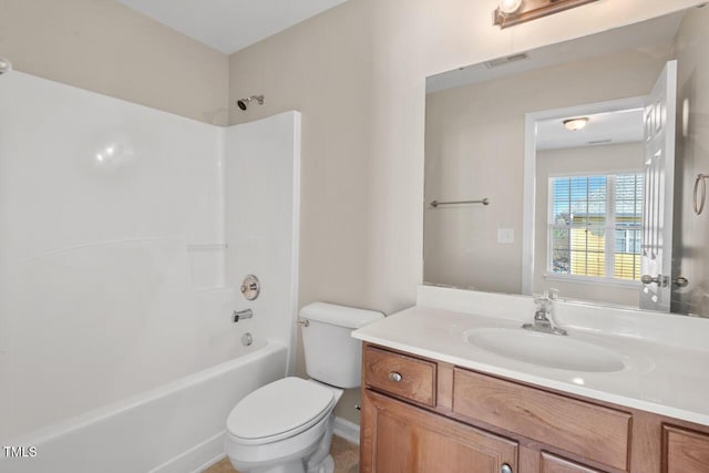 bathroom with toilet, visible vents, tub / shower combination, and vanity