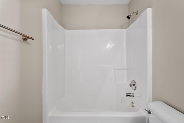 full bathroom with shower / bathtub combination and toilet