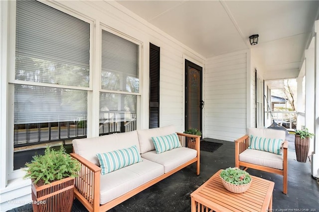 view of patio with an outdoor living space and covered porch