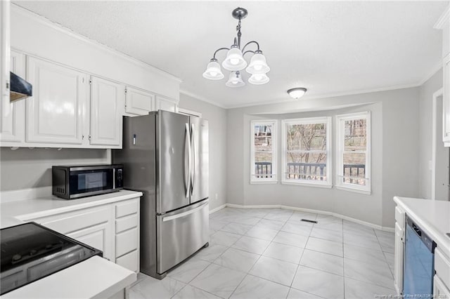 kitchen with a chandelier, appliances with stainless steel finishes, ornamental molding, and light countertops