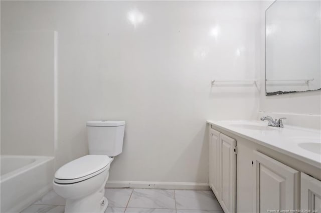 bathroom featuring toilet, marble finish floor, a sink, double vanity, and baseboards