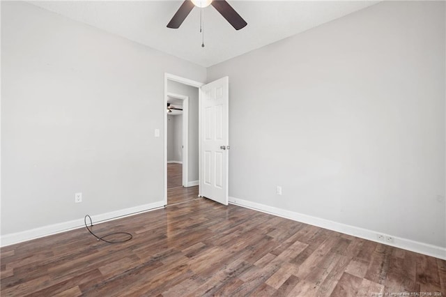 spare room with wood finished floors, baseboards, and ceiling fan