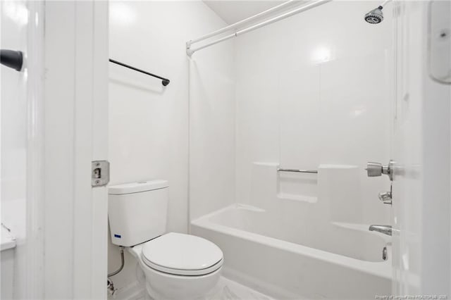 bathroom with toilet and  shower combination