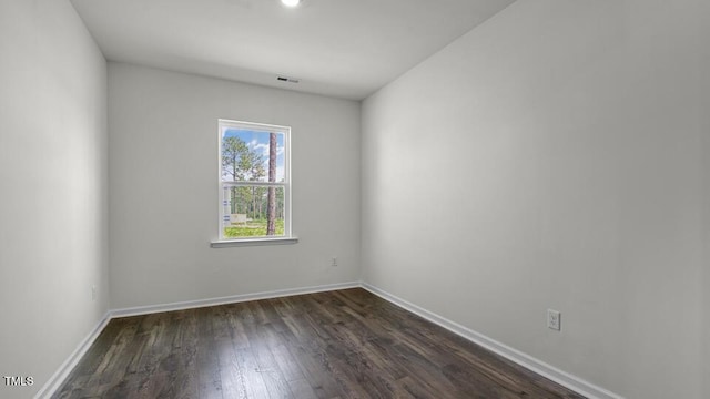 3040 Platinum Cir W, End, NC 27376 - spare room featuring dark wood-style flooring and baseboards