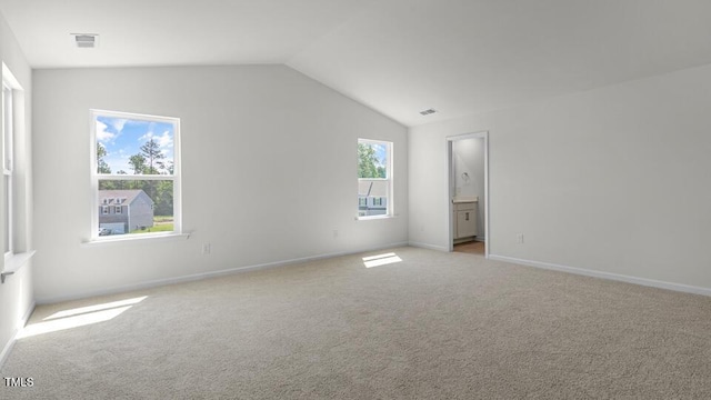 3040 Platinum Cir W, End, NC 27376 - unfurnished bedroom with light colored carpet, vaulted ceiling, and ensuite bathroom