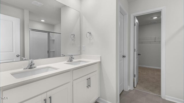 3040 Platinum Cir W, End, NC 27376 - full bath with a spacious closet, double vanity, and a shower with shower door